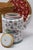 A colorful Chinese porcelain teapot paired with a fitted woven warming basket, bringing together intricate decoration and...