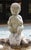 Mid-20th century cast stone bird bath, English. Pan playing his pipes while seated on the edge of a wonderful large shell....