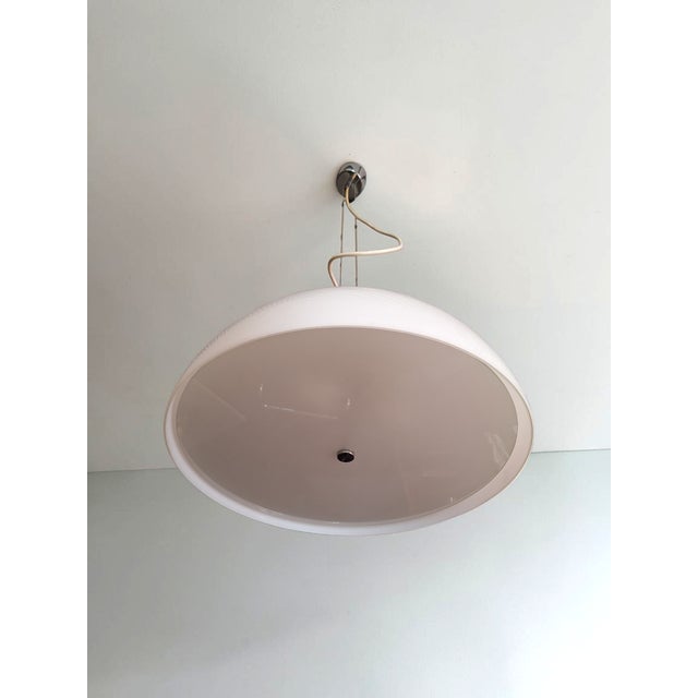 Am/as model pendant lamp designed by franco albini and franca helg in the 1960s for sirrah. The lamp features a milk glass...