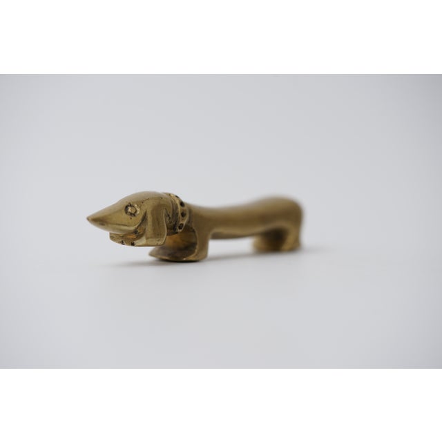 Object: Bottle opener in the shape of a dachshund Designer: Walter Bosse (1904–1979) Age: 1950s/1960s Material: Brass...