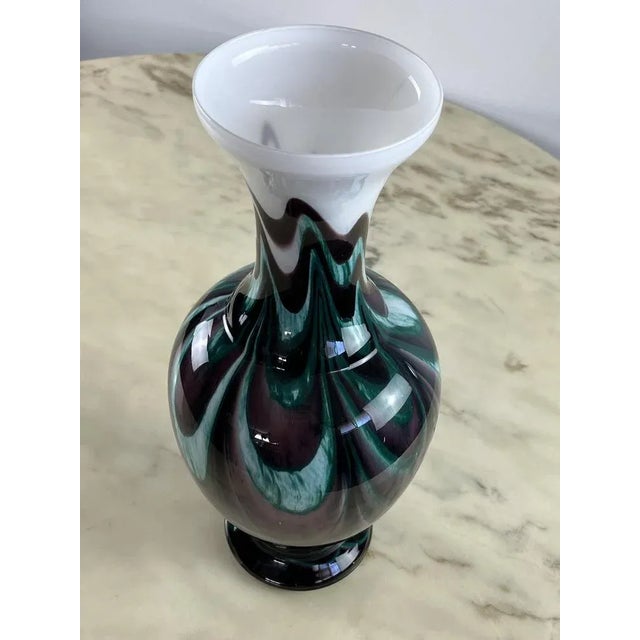 Opaline glass vase. For opal glass (or opal or lattimo glass) is meant a dairy glass, which can be white or colored and is...