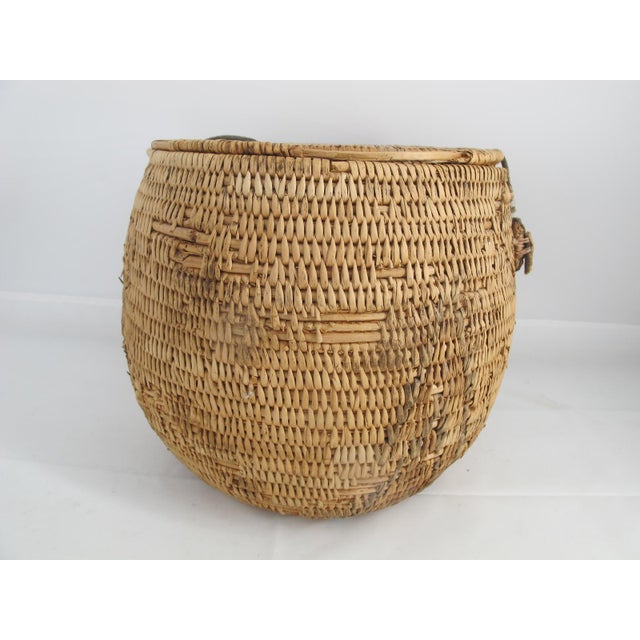 Antique Northwest coast Native handwoven basket with removable fitted lid and handle. Hand-woven natural fibers showing...