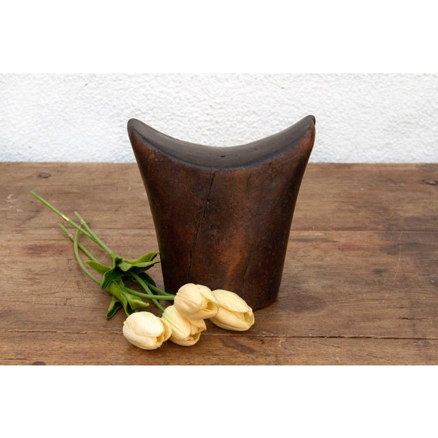 This antique Sidama headrest is more than just a piece of wood; it's a testament to the artistry and traditions of...