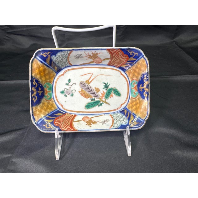 A stunning matched set of five Japanese Arita Imari porcelain rectangular serving trays from the Late Edo–Early Meiji...