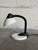 This adjustable gooseneck desk lamp features a flexible neck for directed lighting. Vintage 1980s. Crafted with a white...