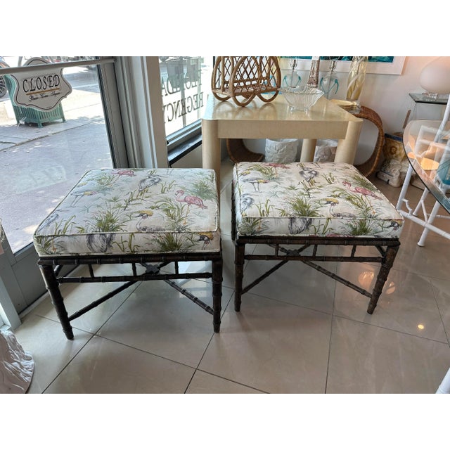 Lovely pair of vintage faux bamboo ottomans, benches, stools. Newly upholstered in a bird fabric. Original wood finish. No...