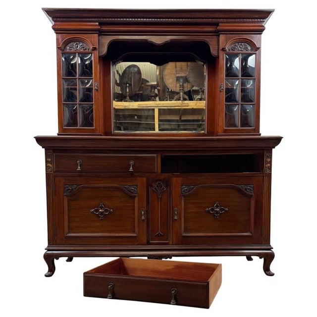 An outstanding early 20th-century Arts and Crafts mahogany sideboard, beautifully crafted and distinguished by its...