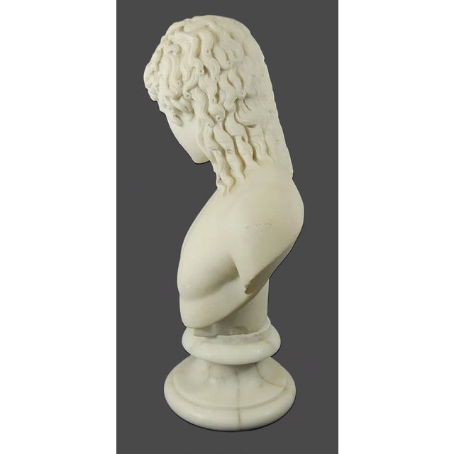 An elegant Italian carved Carrara marble bust depicting Eros of Centocelle, one of the most celebrated classical...