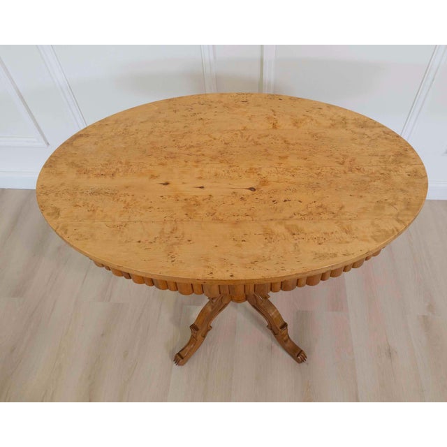 Made in Sweden around 1880, this oval occasional table is constructed in solid birch. Birch, a pale, fine-grained timber,...