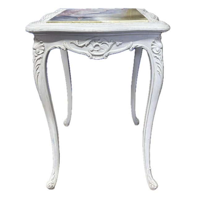 A small carved and painted wood French side table with the impressive onyx top. This French early 20th century side table...