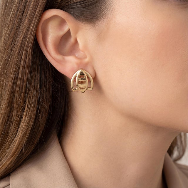 A vintage pair of 18k yellow gold, contemporary-designed bee stud earrings. Featuring a geometric design with openwork...