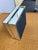 The box features a hinged lid and is constructed with beveled glass panels having a shiny, reflective finish. Its compact...