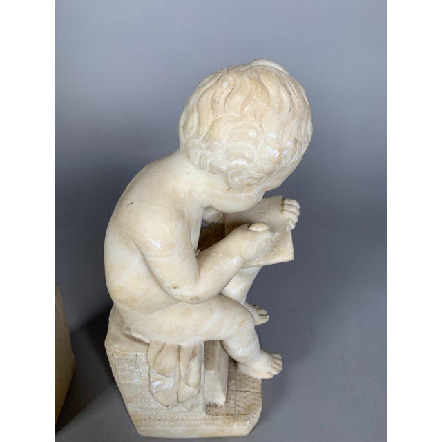 Two 19th Century Marble Sculptures: The Child Scribe and The Reader, After Lemire For Sale - Image 6 of 11