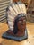 Wonderful early folk art carved wooden bust depicting a Native chief wearing a traditional feathered headdress with aged...
