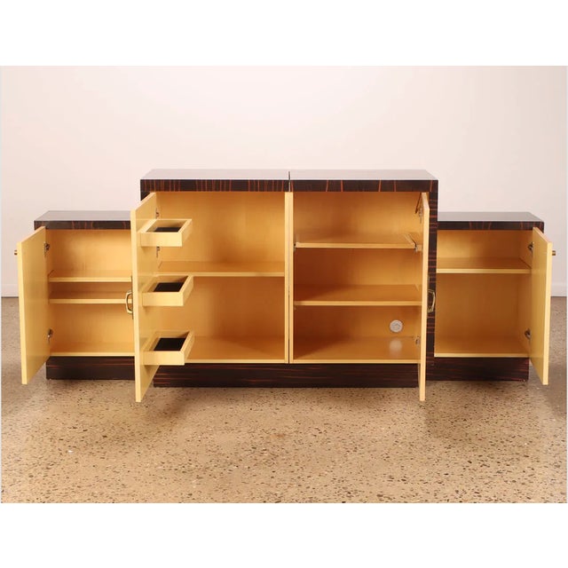 This elegant French Art Deco sideboard is crafted from luxurious Macassar ebony, showcasing a bold and sophisticated...