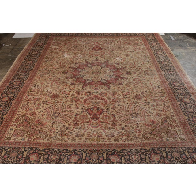 Hand knotted in wool originating circa 1950-1960, this 11x15 vintage Persian rug connotes a mid-century Tabriz rug style...