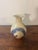 Charming mid-century American studio pottery vase, hand thrown and finished in a soft off-white glaze with bold,...
