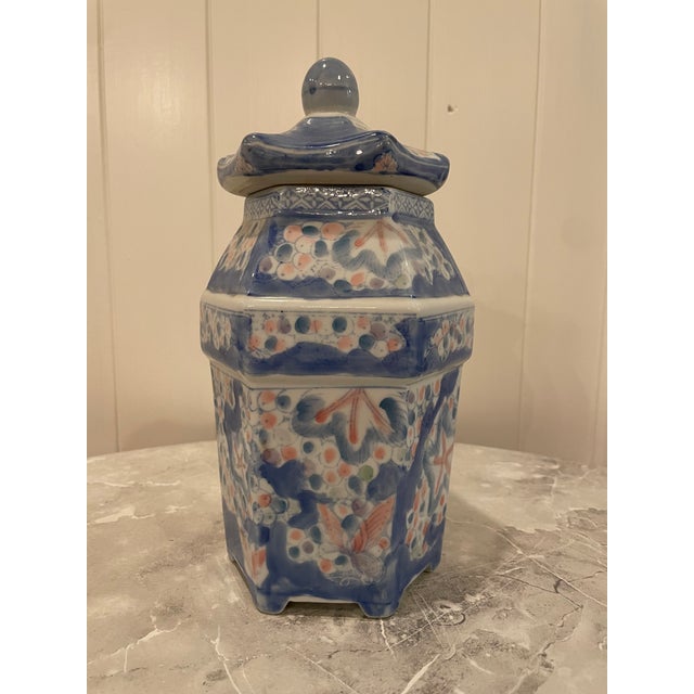 Lovely hexagonal vase/ginger jar with hand painted abstract like scenes on each of the six sides. Perfect vintage addition...