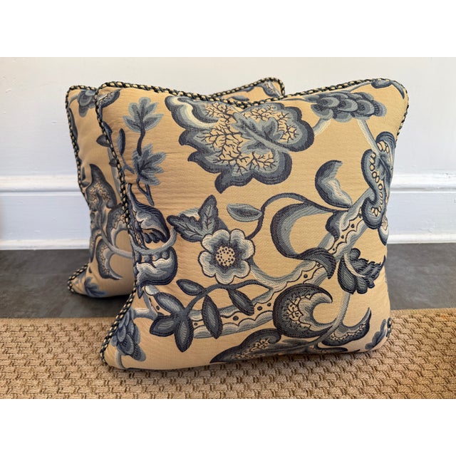 Plush pair of English-style Jacobean floral pillow pair in blue and tan. With a coordinating rope trim and soft down-...