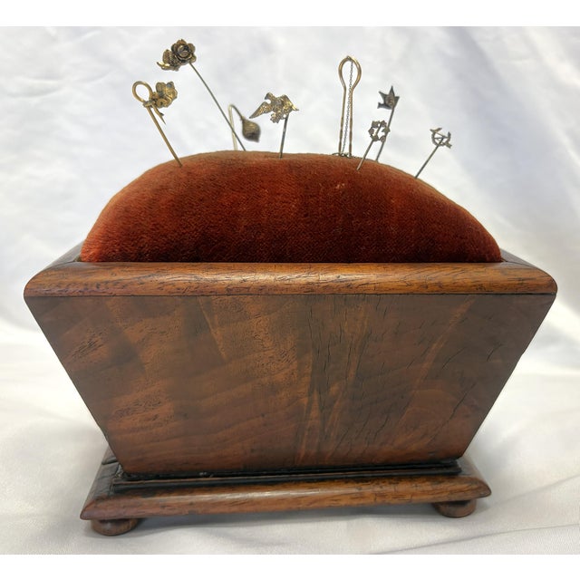Precious antique sewing box from the 19th century. It is made of rosewood in a casket form with compressed turned wood...