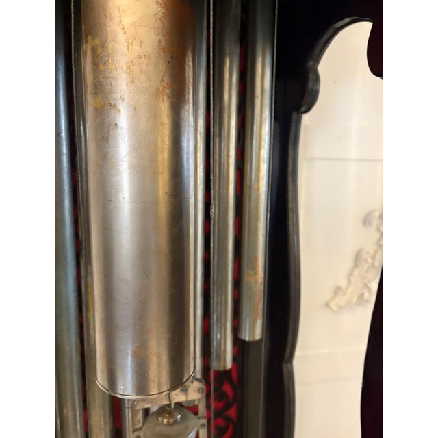 An exceptional exhibition quality carved mahogany longcase clock of impressive scale and presence, richly decorated...