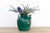 This antique pottery jar, bathed in a rich emerald green glaze, exudes a timeless charm and rustic elegance. Likely...
