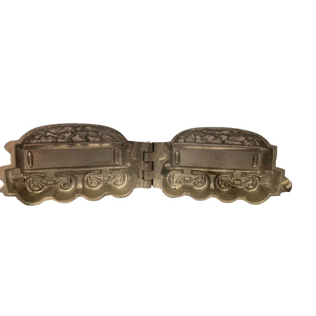 Art Deco chocolate mold in the shape of a caboose. The caboose is stamped 478.