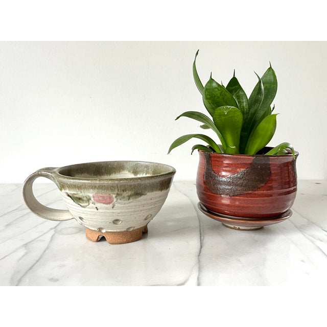 Vintage studio art pottery berry strainer with handle. Signed by artist on the bottom. No chips or cracks.