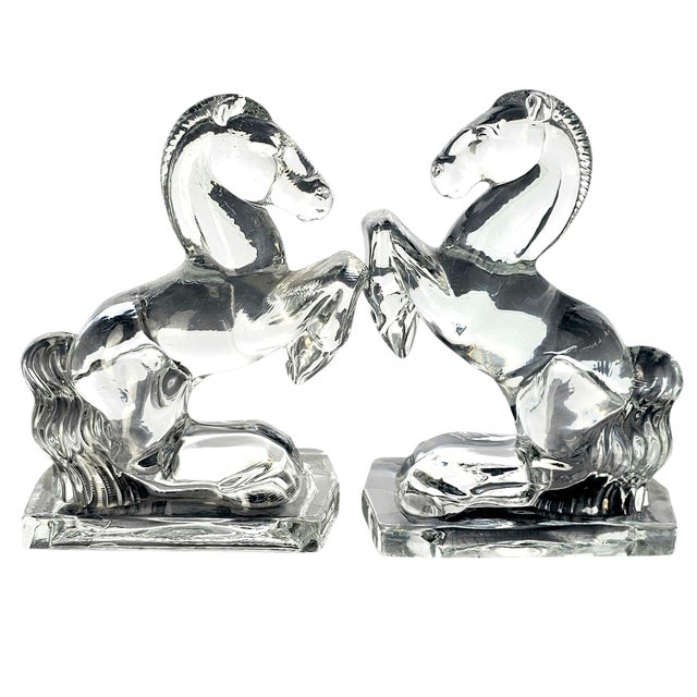 Crafted in West Virginia during the 1930s–1940s, these rearing horse bookends by New Martinsville Glass reflect the bold...
