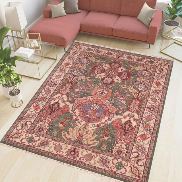 Elevate your space with this hand‑knotted wool rug, crafted by skilled artisans using time‑honored weaving techniques. The...