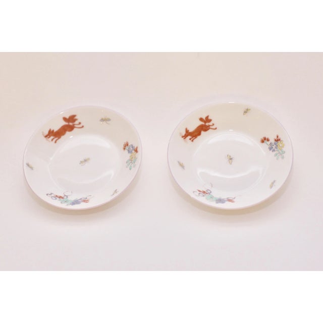 Beautiful pair of early 18th century hand painted Limoges plates. One plate has a smaill chip on the edge, please see...