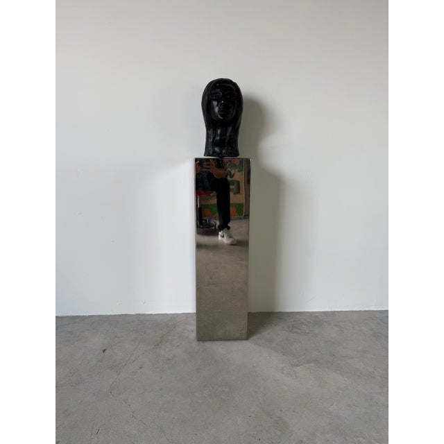 Striking vintage postmodern sculpture female bust displayed atop a chrome pedestal. This dramatic gallery-style piece...