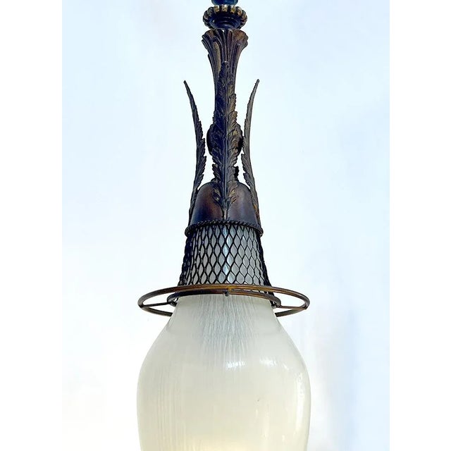 Small Dutch chandelier in bronze and white striped glass dating back to the early 1900s. The upper part of the chandelier...