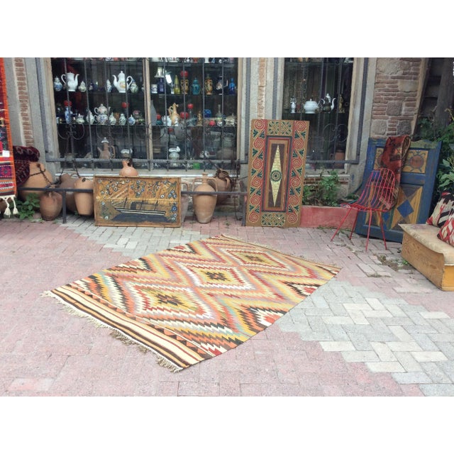 This beautiful, vintage, handwoven kilim is approximately 60 years old. It is handmade, of very fine quality hand spun...