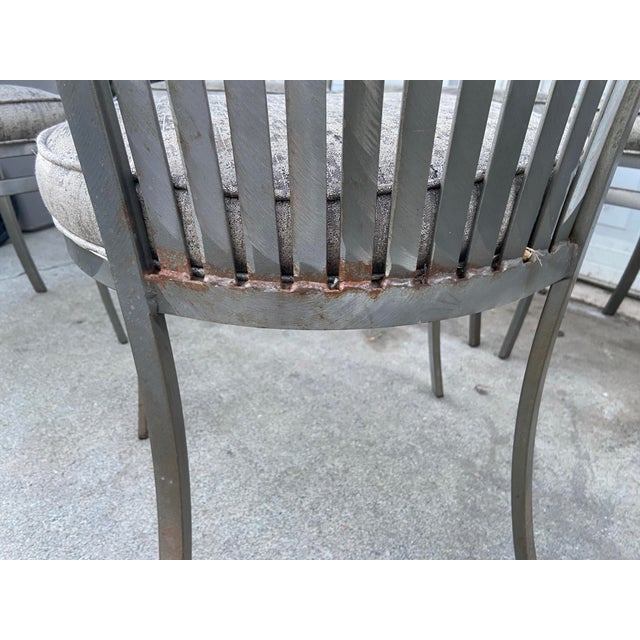 The Late 20th Century Modern Shaver Howard Slatted Steel Back Dining or Side Chairs are a set of 6 sleek silver chairs...