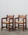 Pair of vintage Mexican walnut armchairs with curved arms and woven rush seats. Includes both chairs; the small table...