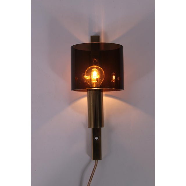 This elegant wall light, designed and manufactured by Hassel & Teudt in Denmark during the mid-late 1960s, features a...