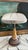 A striking Art Deco table lamp featuring a substantial frosted molded glass dome shade atop a beautifully proportioned...