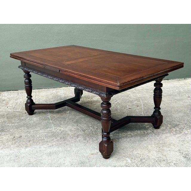 This magnificent refectory-style dining table is a masterclass in traditional European craftsmanship. Featuring a robust...