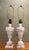 Pair of Italian carved alabaster table lamps with elegant neoclassical styling, dating to the mid-20th century. These...