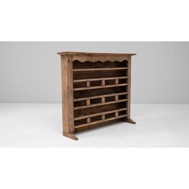 This 19th Century French Louis XV oak plate rack showcases the graceful curves and rural elegance associated with...