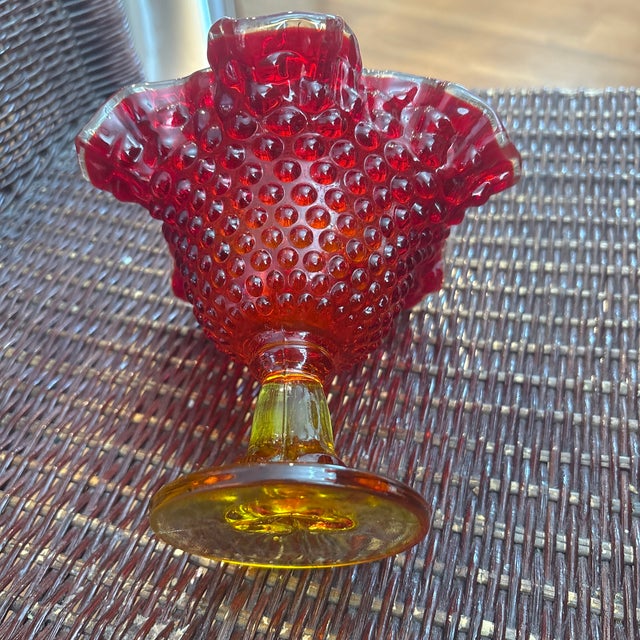 Fenton Amberina hobnail ruffled pedestal compote candy dish.Colorway: Known as "Amberina," this glass transitions from a...