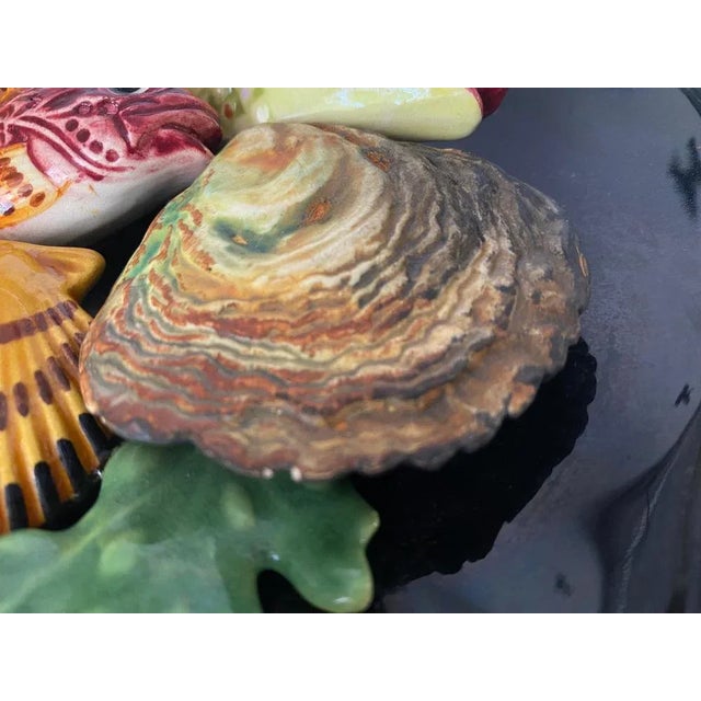 This is a Majolica ceramic Plate for the Decoration. It has been made in France in the 1960s. His colors are black, Yellow...