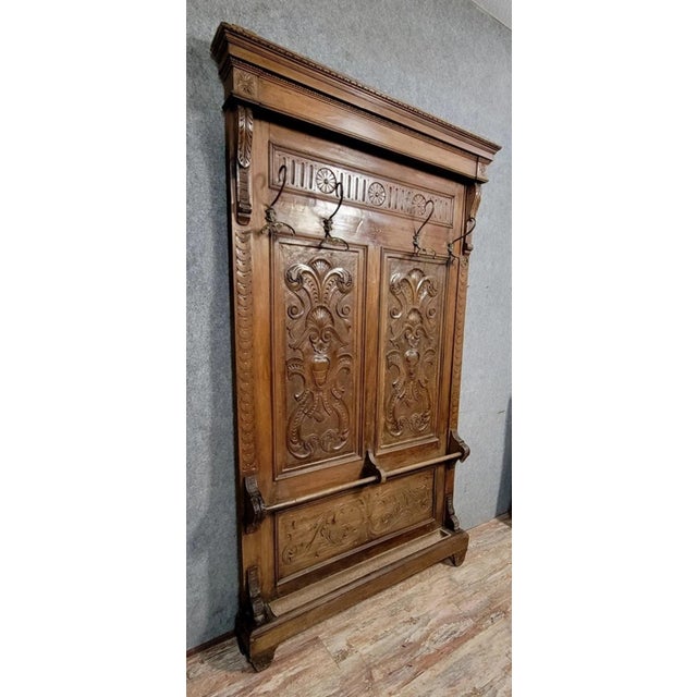 Renaissance-style coat rack in carved walnut, 19th century. four hooks in total. umbrella stand with zinc reservoirs....