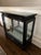 Asian Chinoiserie Pagoda Style Black Glossy Wood Cabinet with glass sides, top, doors and one glass shelf. There is a...
