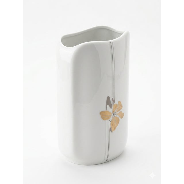Vintage Dutch porcelain vase by Royal Schwabap. Modernist design with gold floral motif from the 1970s/80s. Features...