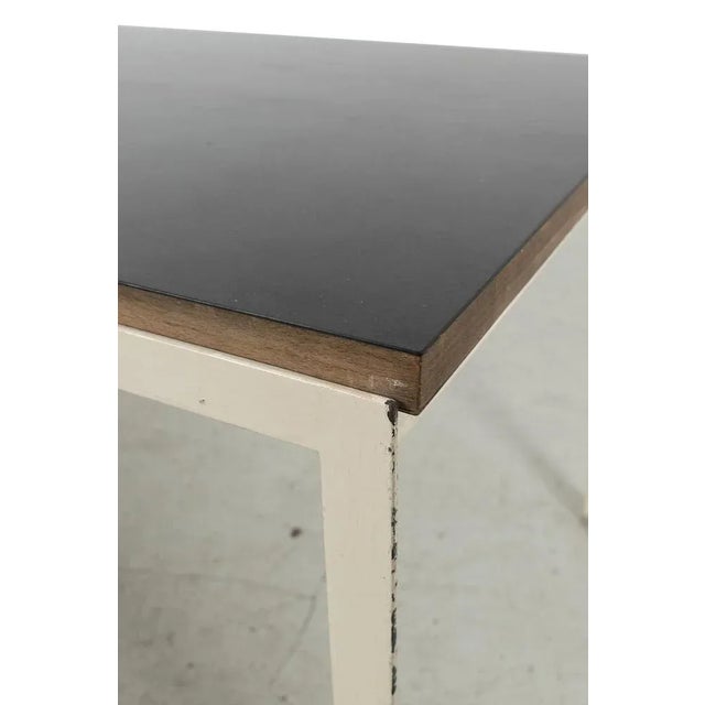 Sleek Florence Knoll Coffee Table from the 1970s. The Table has a Wooden top and a metal base with some signs of wear....