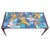 Stunning metal coffee table with a top of inlaid colorful tiles in the shape of birds, 1970s. The table has a heavy metal...