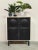 Graphic, bold, and delightfully striking. This brutalist cabinet from the 1970s has it all: a sleek black front with...