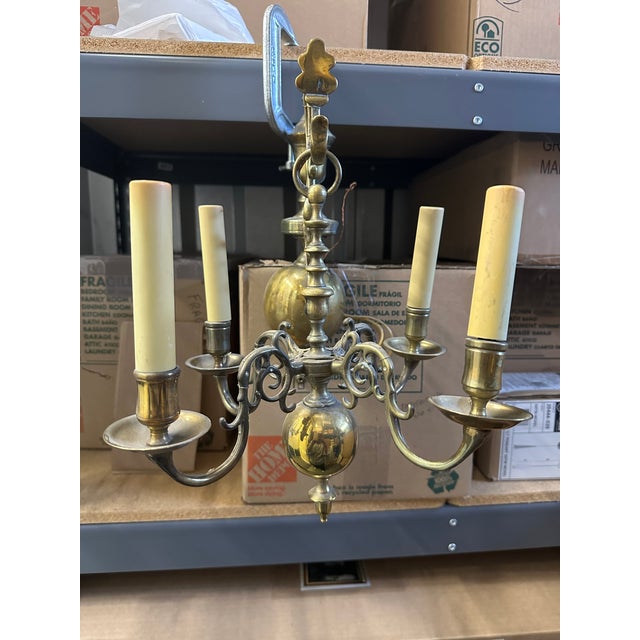 A pair of rare Flemish, early 19th Century, solid brass Pendant-sconces, circa 1840. Hard wired fixtures with 4 candles each.